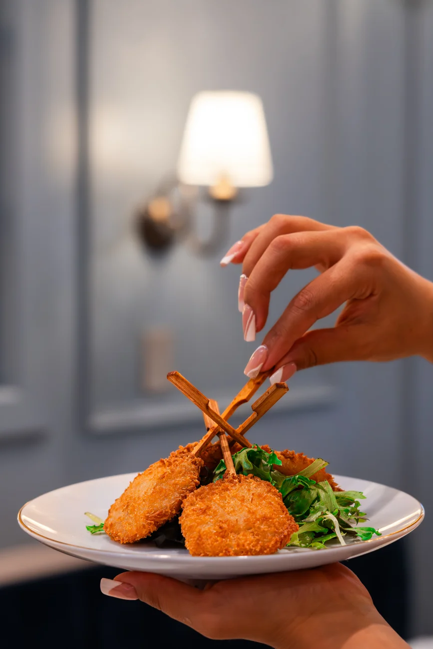A plate of crisp savory bites served at the table