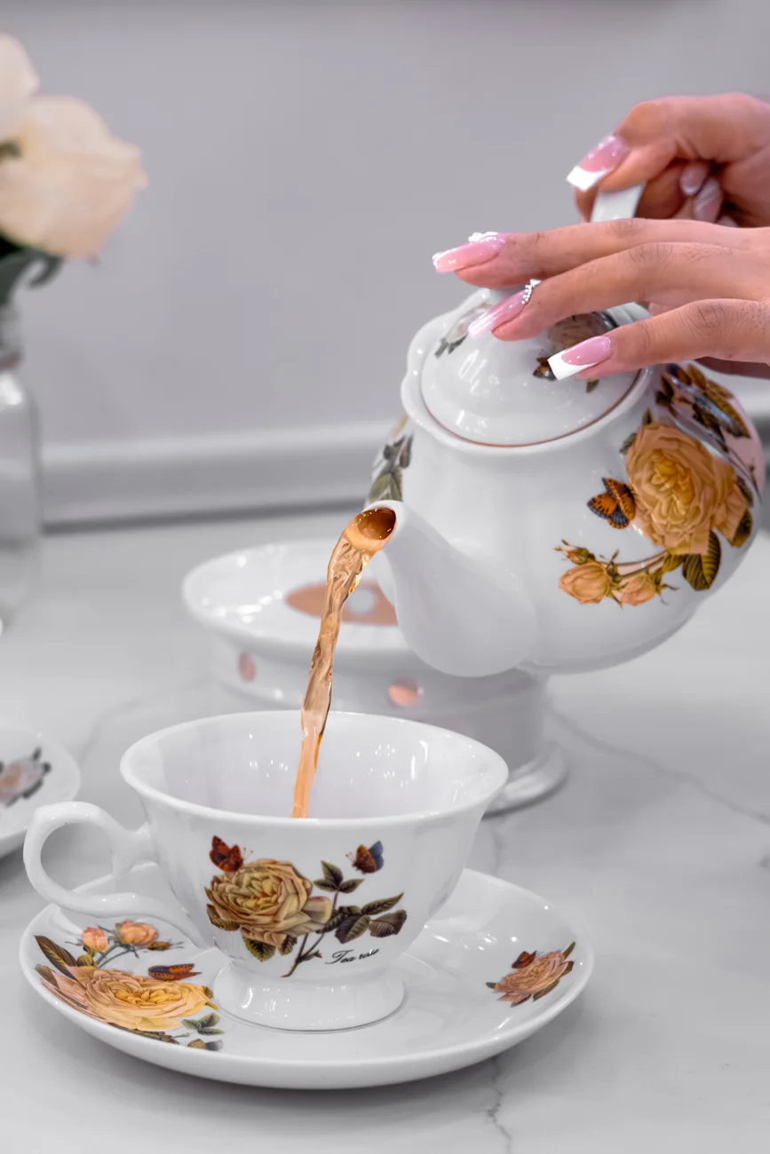 Tea poured from a floral porcelain teapot