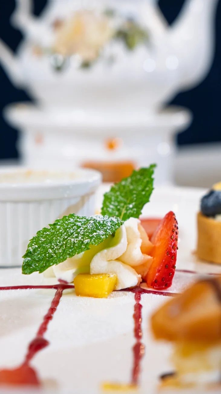 Delicate plated dessert with fresh fruit and mint